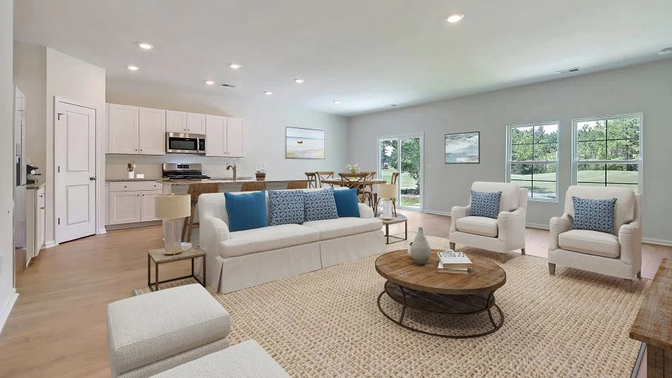 Bright furnished living room with an open kitchen